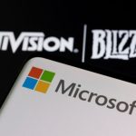 Microsoft agreement, Credit@ Microsoft logo is seen on a smartphone placed on displayed Activision Blizzard logo in this illustration taken January 18, 2022. REUTERS/Dado Ruvic/Illustration